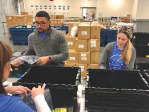 A man and woman volunteering