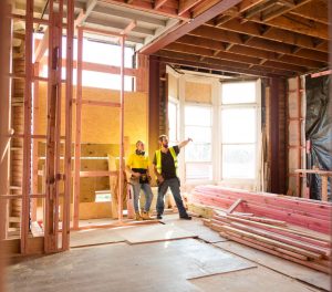 Man and woman standing at construction site