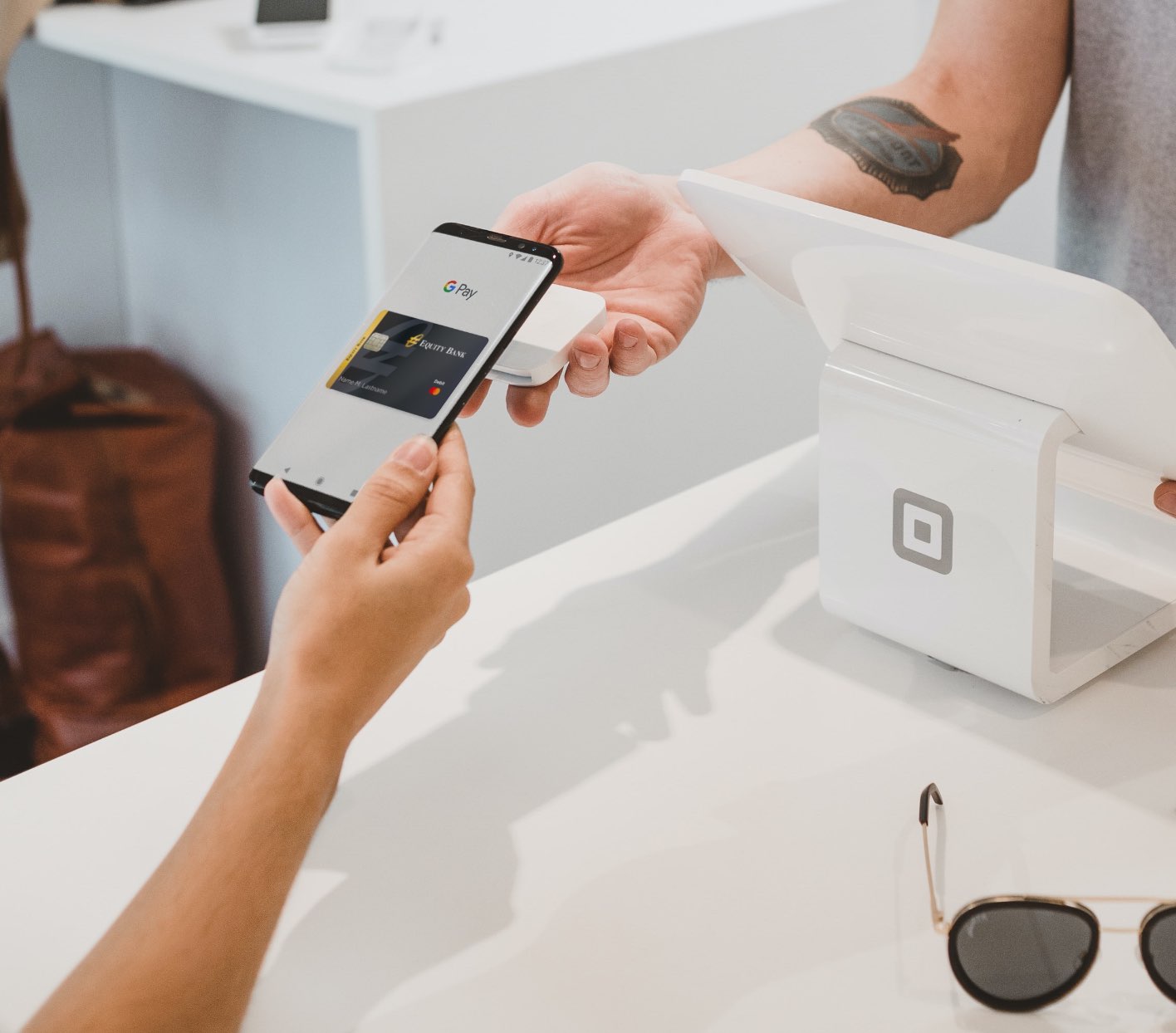 Person using Equity card with Google Pay
