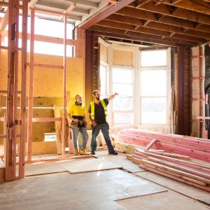 A man and woman inside a construction site