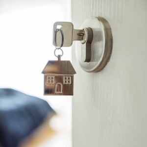 key in lock with house-shaped keychain
