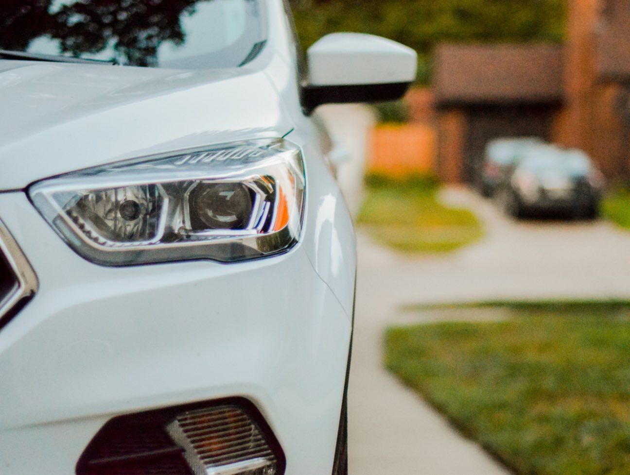 Close up of car front and headlight.