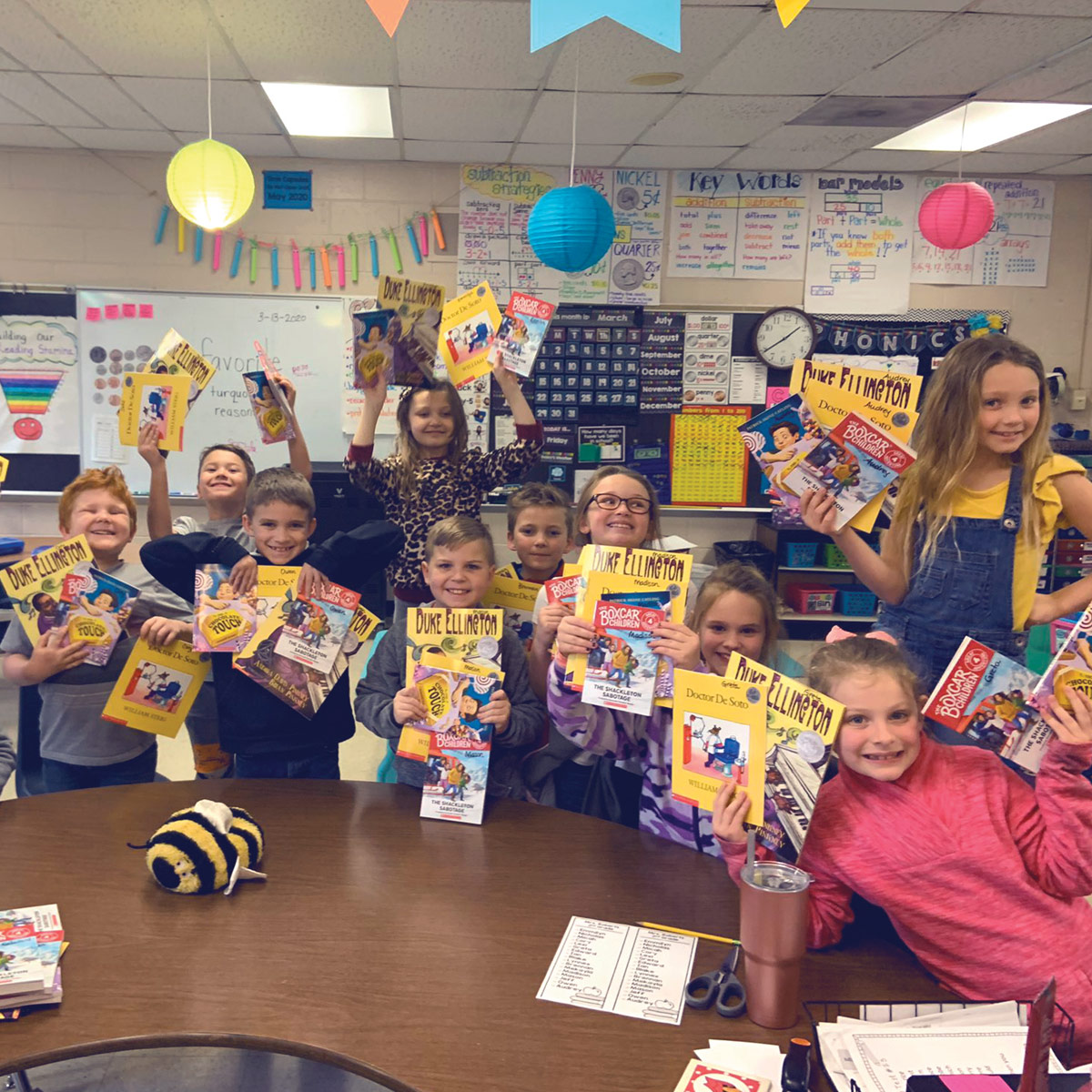 Bank on reading classroom showing kids with materials.