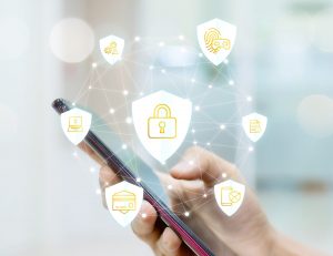 Smartphone overlaid with security icon graphics.