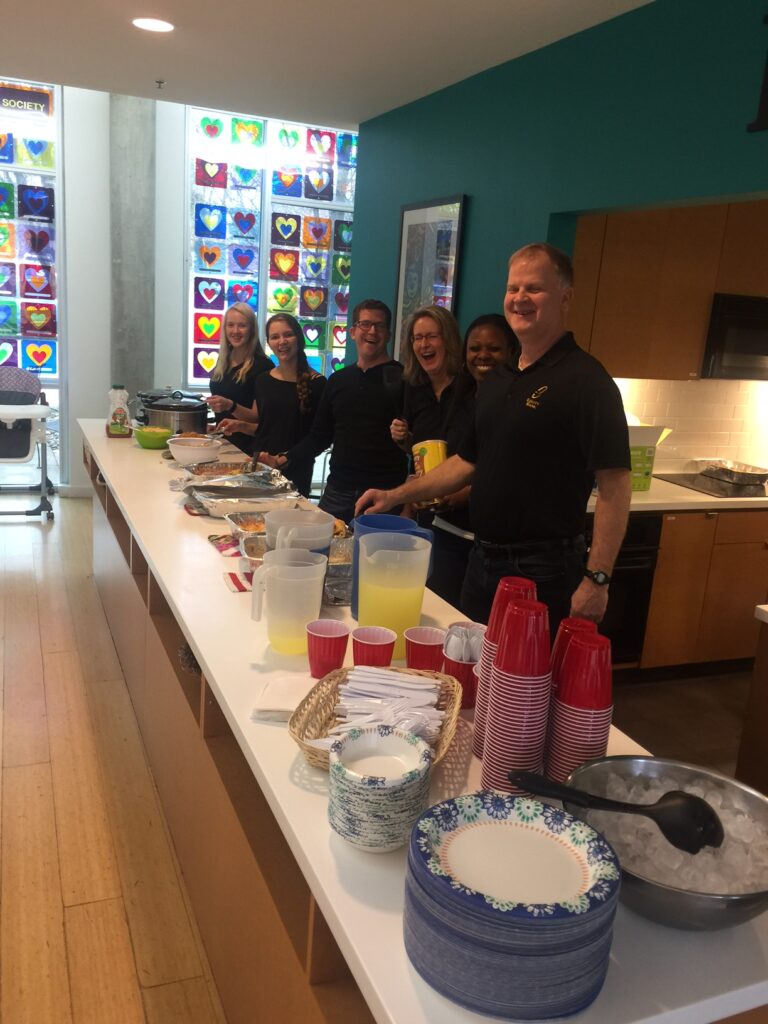 Adults serving a Meal