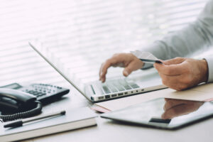 Businessman doing Online Banking on Laptop