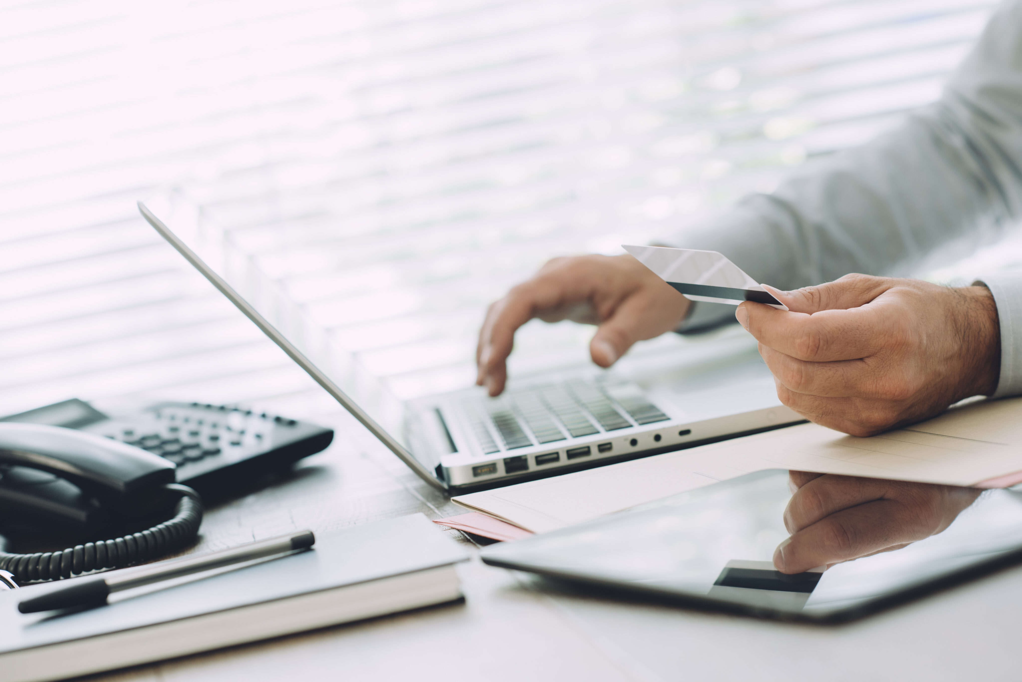 Businessman doing Online Banking on Laptop