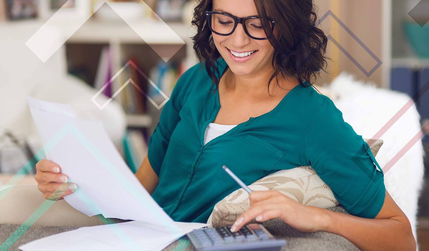 Girl calculating her mortgage on paper with a calculator