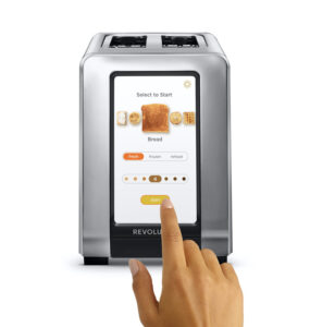 Smart toaster with hand touching screen.