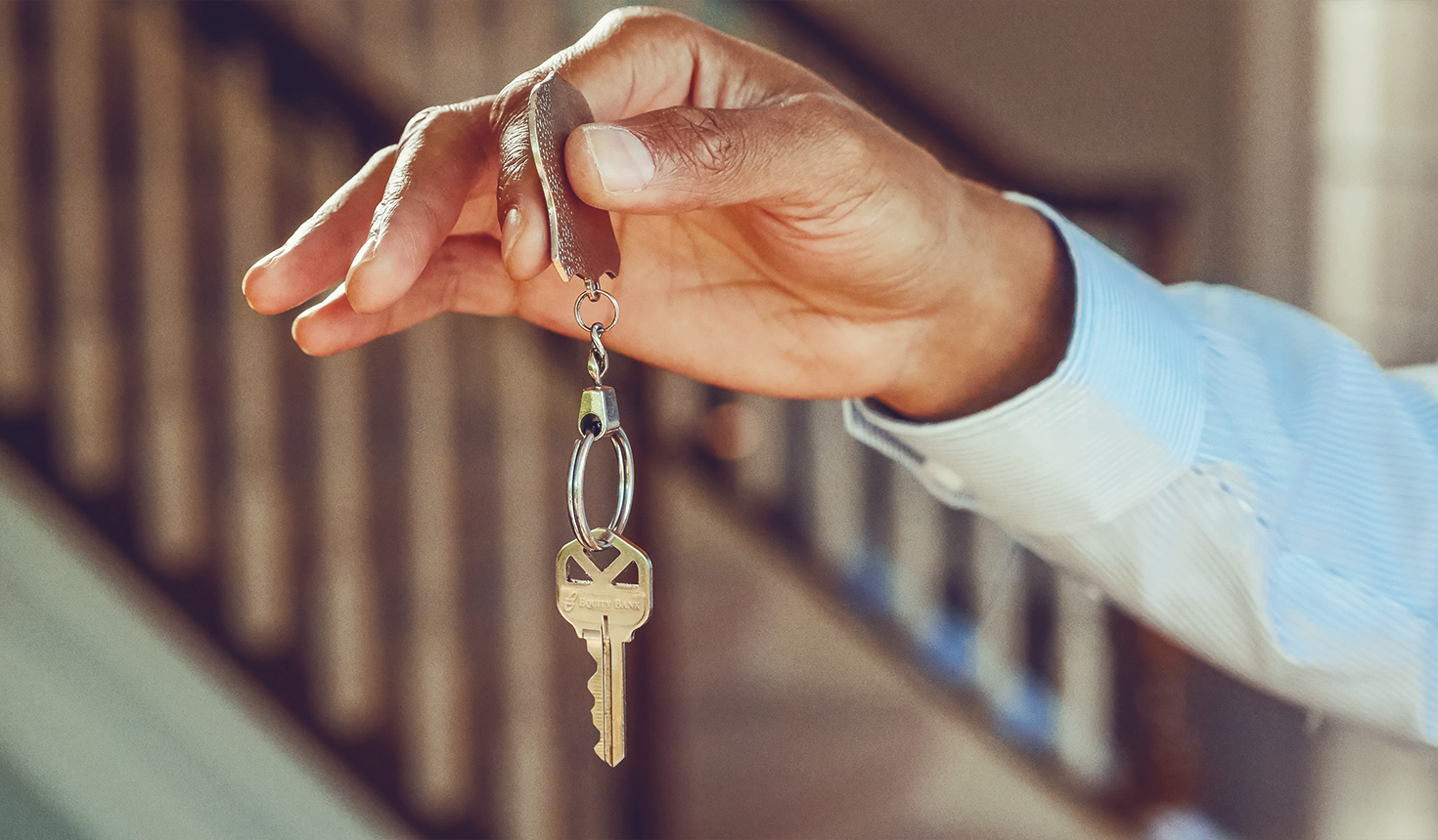 Giving house keys over after securing a mortgage loan in kansas