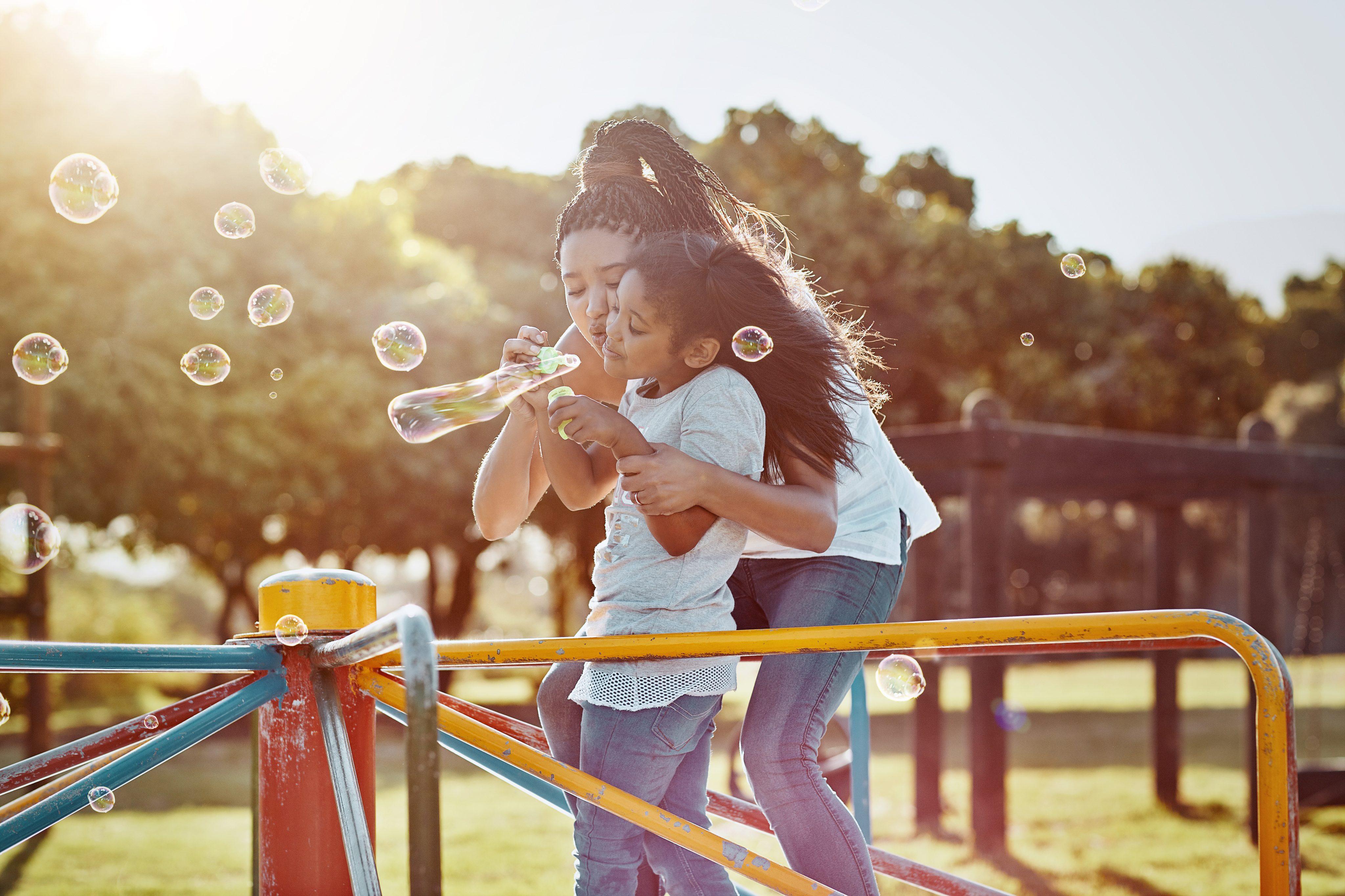 mother and daughter blowing bubbles in overland park, ks