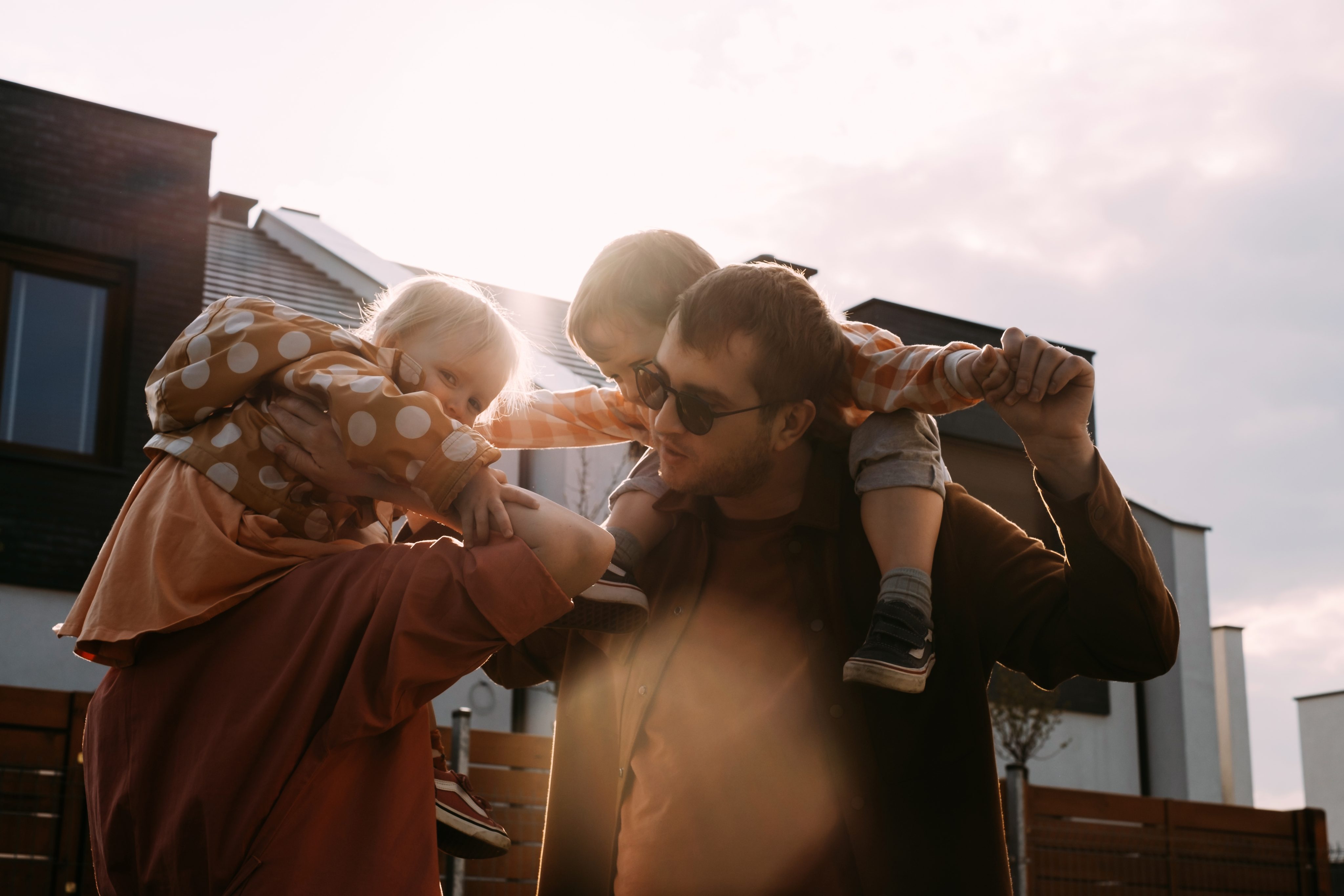 Young family playing together and living with financial freedom