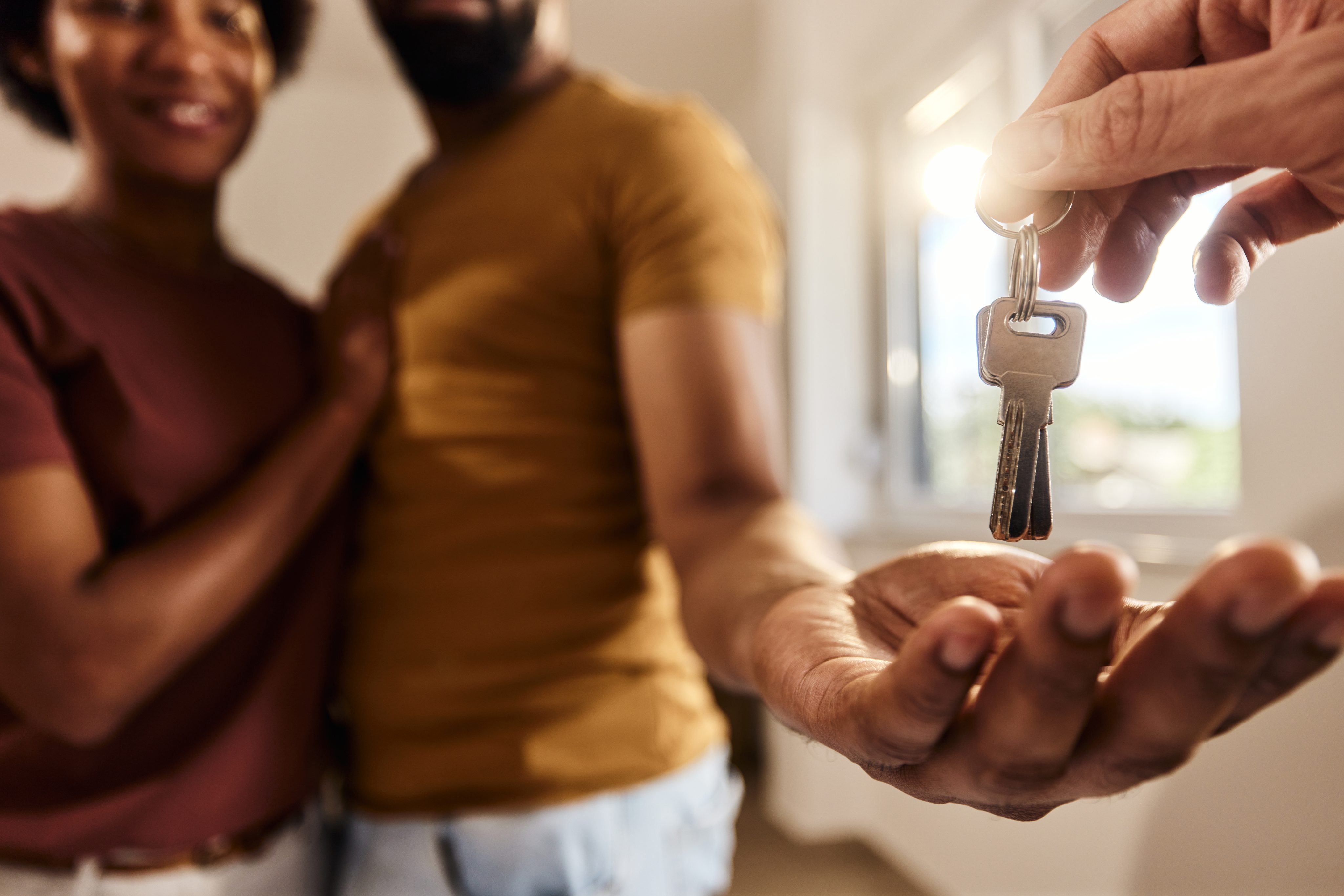 A couple has been approved for a new mortgage and is moving into a new home.